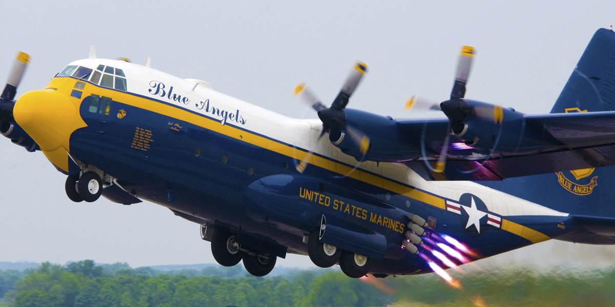 The Blue Angels’ C-130 Hercules transport, Fat Albert, performs a Jet Assisted Take-off (JATO). Eight solid fuel rockets, four mounted on each side, provide an additional 8,000 pounds of thrust for take-off on short or damaged runways. U.S. Navy Photo by Photographer’s Mate 2nd Class (AW/NAC) Ryan Courtade. (RELEASED)