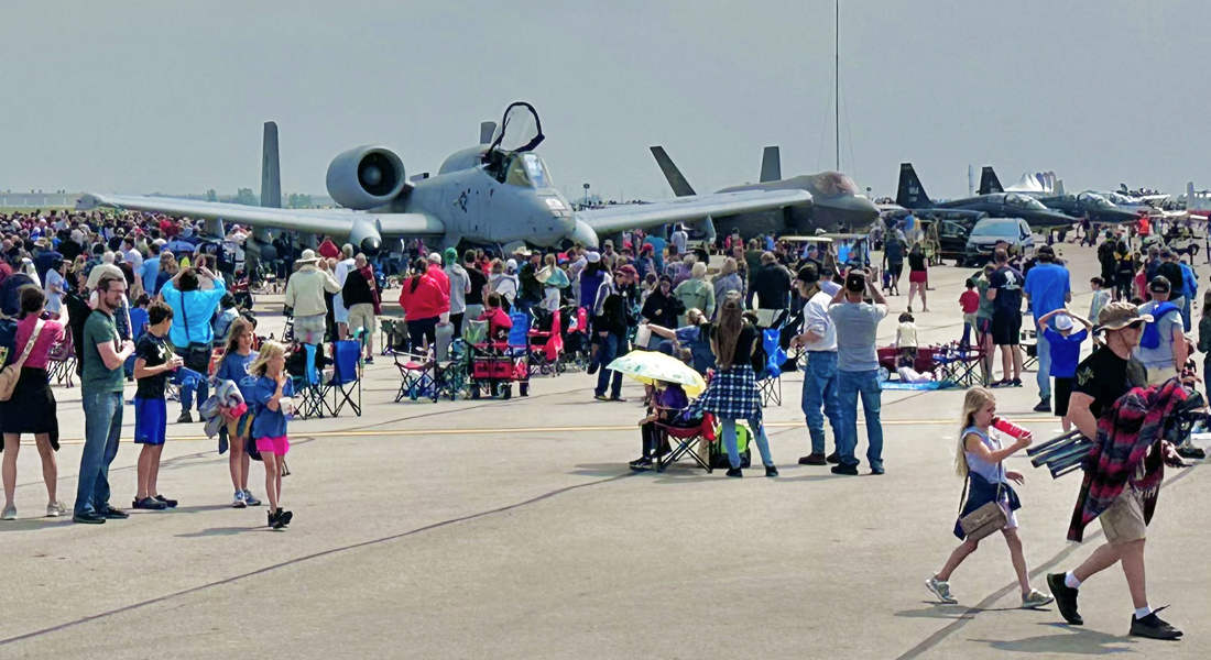 Columbus Air Show General Admission  - Patrons on the tarmac in front of static plane displays.